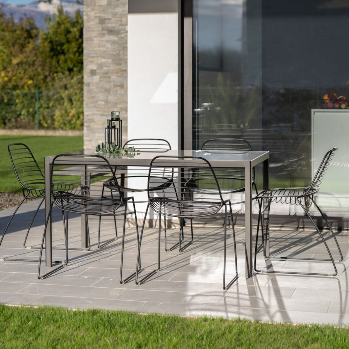 black-chairs-around-table-on-porch