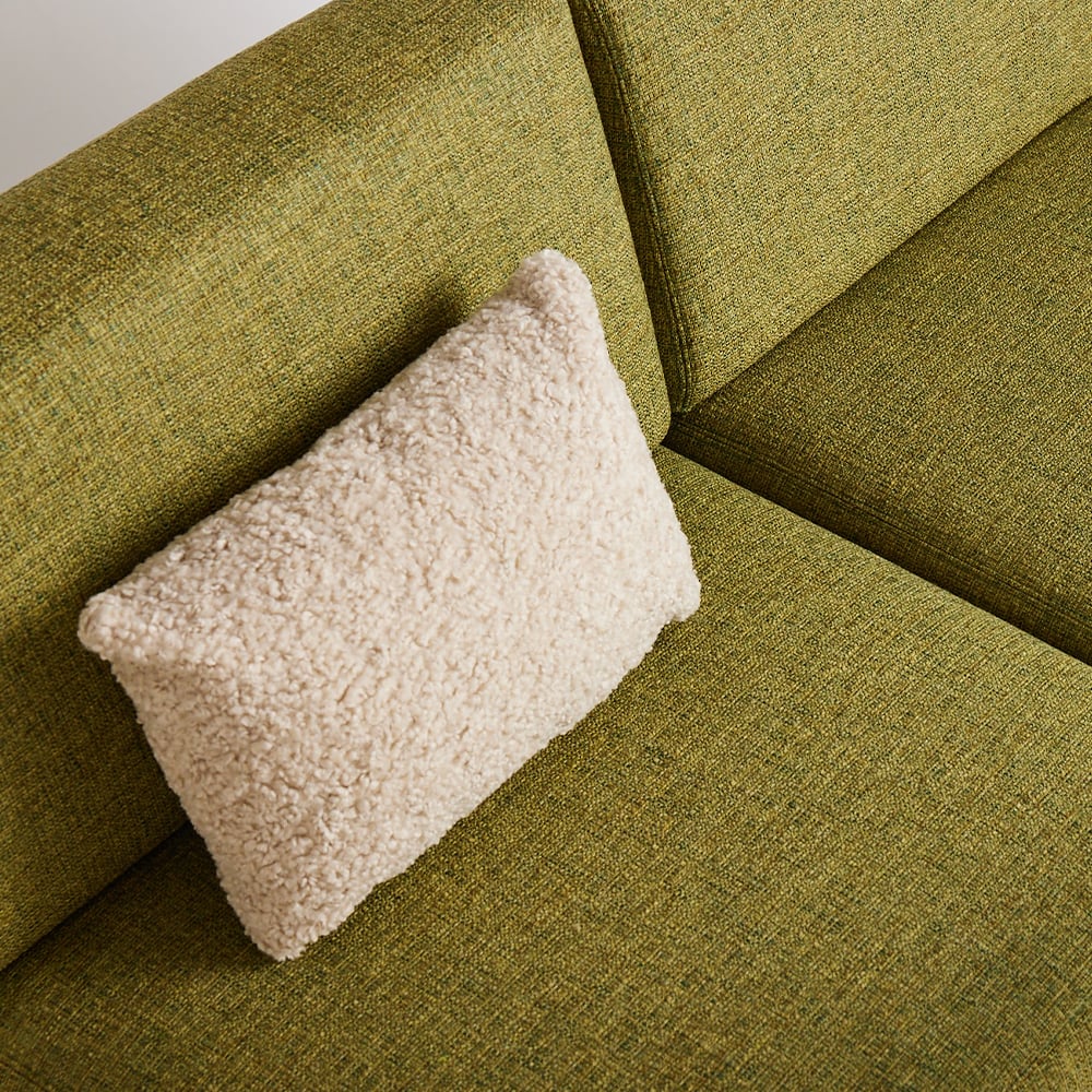 rectangle-pillow-in-wool-on-green-sofa