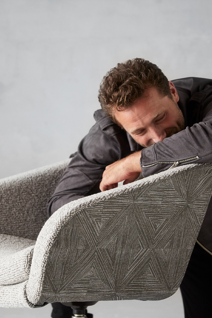 man-hugging-edge-chair