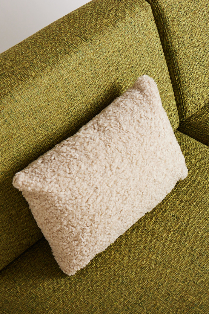 pillow-in-wool-on-green-sofa